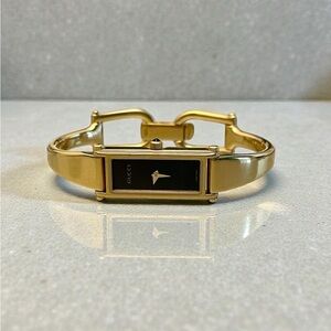 Vintage Gucci Gold Bangle Watch with Black Dial